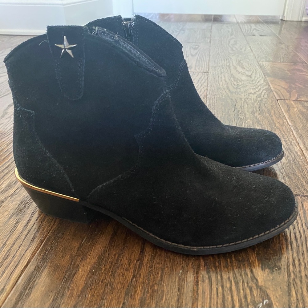 Black suede booties with gold star embellishment